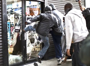 looter kicking in a shop window