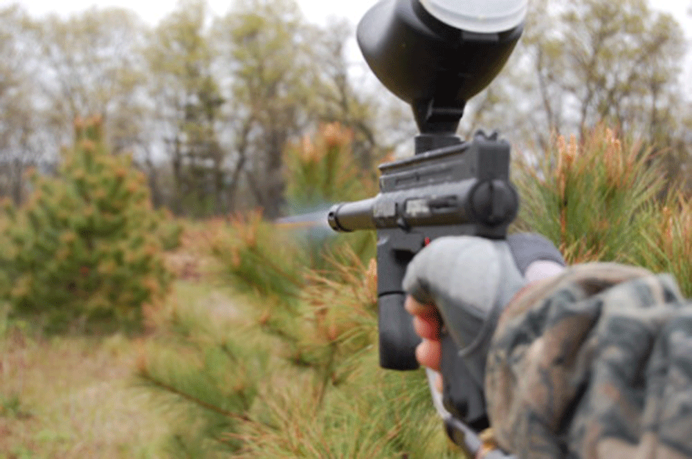paintball gun firing in feild