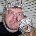 man and cat wearing foil hats