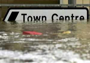 road sign under flooded water