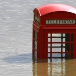 red telephone box in flood water