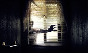 man breaking into a house