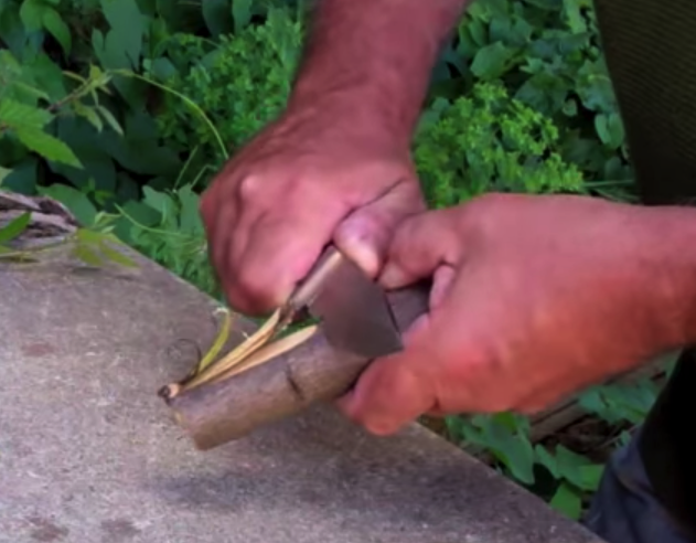 feathering wood with a knife