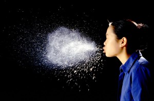 woman sneezing