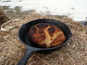 cooking bannock bread over open fire